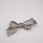 Art Deco Colombian Emerald & Diamond Bow Brooch in Platinum, Circa 1920s