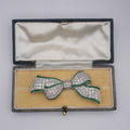 Art Deco Colombian Emerald & Diamond Bow Brooch in Platinum, Circa 1920s