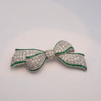Art Deco Colombian Emerald & Diamond Bow Brooch in Platinum, Circa 1920s